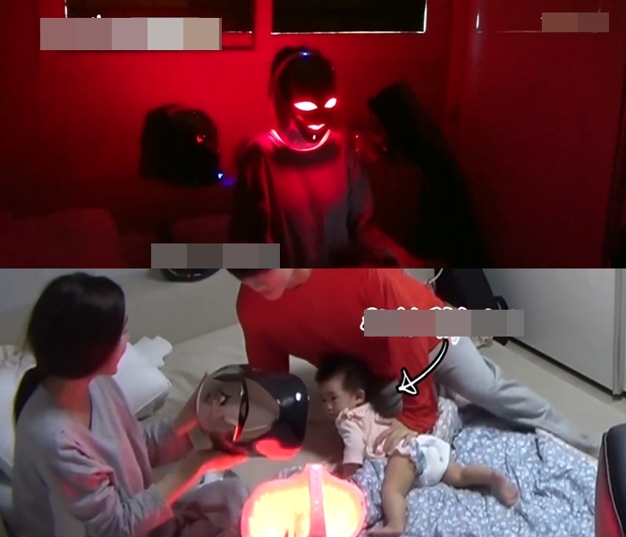 Ham So Won đeo mặt nạ đèn led nhìn giống như siêu nhân để dưỡng da.