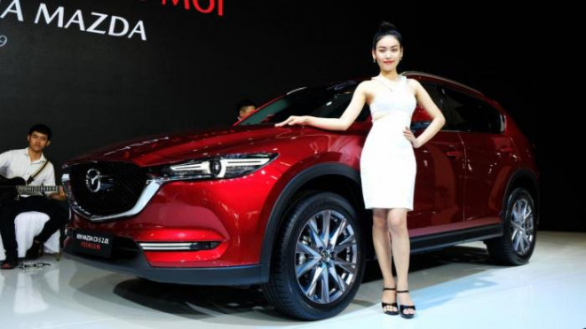 Giảm giá tính phí trước bạ: Khách hưởng lợi khi lăn bánh Mazda và Peugeot - 1