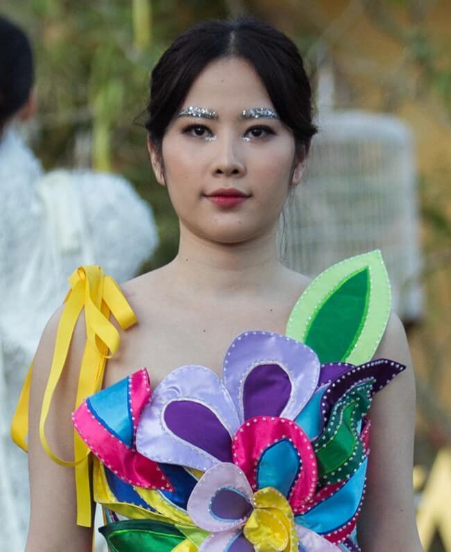 Nam Em được biết đến với danh hiệu Hoa khôi Đồng bằng sông Cửu Long 2015. Sau đó, cô còn đại diện Việt Nam dự thi Hoa hậu Trái đất 2016 và lọt top 8. 
