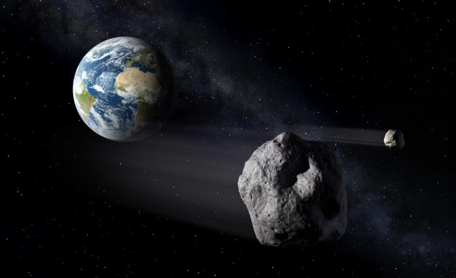 Ảnh đồ họa mô tả một tiểu hành tinh áp sát Trái Đất - Ảnh: SPACE