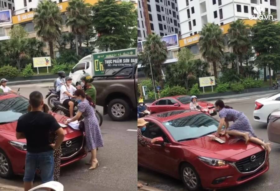 Người vợ trình giấy đăng ký kết hôn cho lực lượng chức năng.