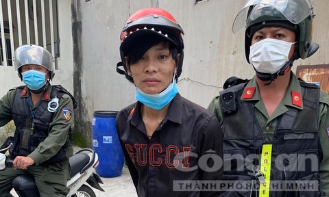 Trần Quốc Khánh bị công an bắt giữ.