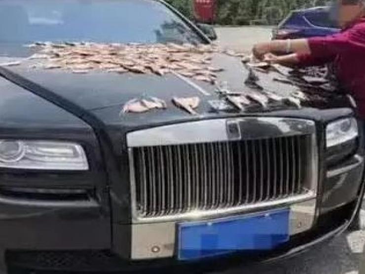 Kinh doanh - Sự thật sau hình ảnh dùng ô tô Rolls-Royce phơi cá gây xôn xao MXH