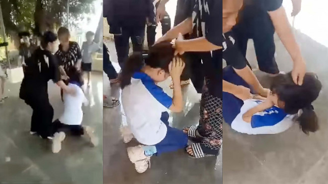 Hình ảnh nữ sinh lớp 6 bị nhóm học sinh đánh hội đồng - Ảnh:Cắt từ clip