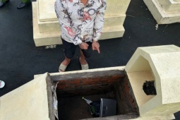 Pháp luật - Mang laptop ăn trộm giấu trong ngôi mộ ở nghĩa trang