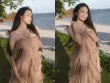 Doãn Hải My đẹp dịu dàng, e ấp khoe vai trần bên bờ biển