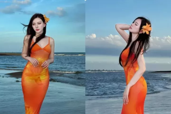 Thu Thủy diện váy cam rực rỡ, khoe vóc dáng nuột nà bên biển