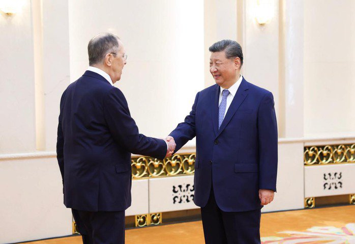 ...và làm việc với Bộ trưởng Ngoại giao Nga. Ảnh: Tân Hoa Xã