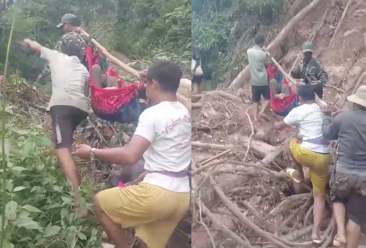 Nhóm người gánh cụ bà băng rừng để ra trung tâm y tế dã chiến cấp cứu, điều trị cho cụ Khăm.