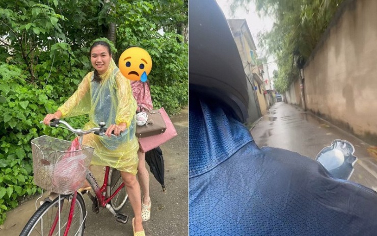 Chị Lan (ngồi sau xe đạp) được người lạ giúp đỡ trong ngày nhiều tuyến đường ở Hà Nội ngập sâu 