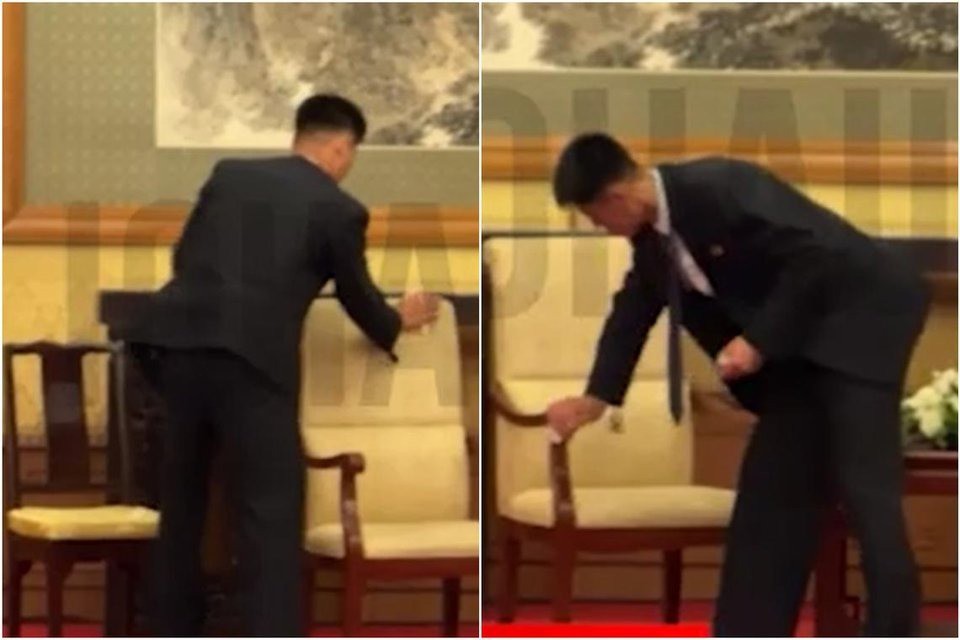 Thành viên phái đoàn Triều Tiên dọn dẹp vị trí ghế ngồi của ông Kim Jong Un. Ảnh: Telegram / Yunashev_live