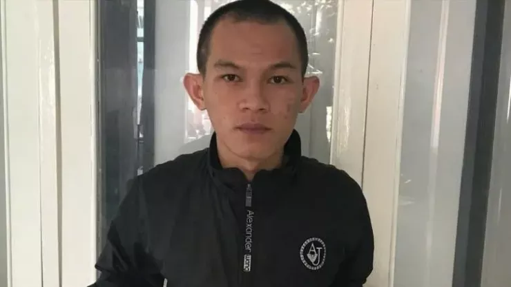 Nguyễn Văn Ty, nghi can đã sát hại Thiếu tá Nguyễn Đông Cánh, sau khi bị bắt giữ. Ảnh: C.A