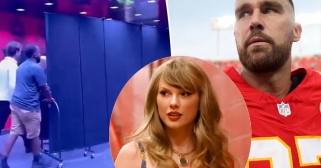 Taylor Swift nấp sau tấm chắn chống đạn tới sân...