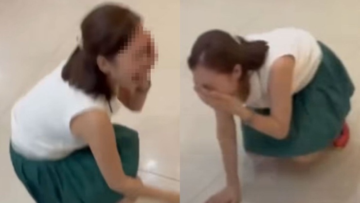 Người phụ nữ ngồi sụp xuống, la hét, kêu mình bị đánh khi tranh cãi với tài xế. Ảnh cắt từ clip 