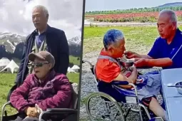 Chồng lái xe đưa vợ liệt đi du lịch suốt 10 năm