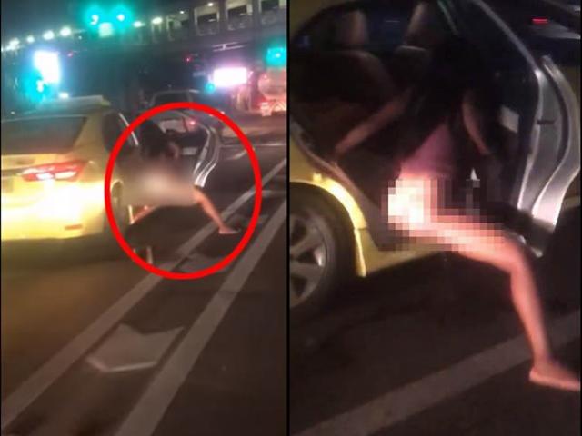 Bạn trẻ - Cuộc sống - Đang dừng đèn đỏ, cô gái thò chân xuống ôtô làm hành động gây sốc