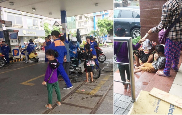 Sau 15-20 phút, những đứa trẻ xin ăn phải nộp toàn bộ số tiền xin được cho một phụ nữ mặc áo carô ở cách đó 100 m. Ảnh: Ý LINH