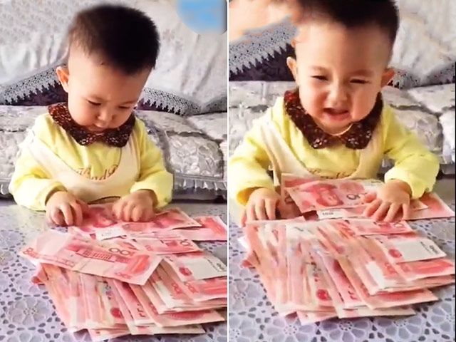 Video Clip Cười - Bé đang tập thói quen đếm tiền thôi mà