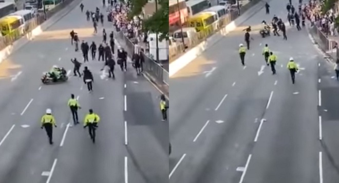 Cảnh sát lao xe môtô thẳng vào nhóm người biểu tình,
