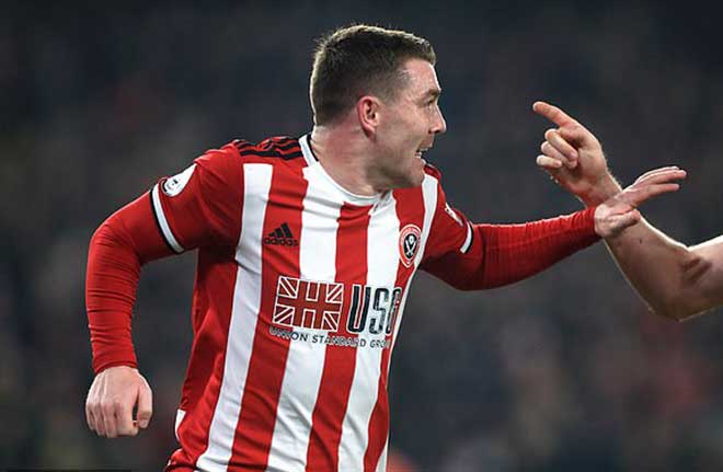 John Fleck mở tỷ số cho Sheffield sau khi De Gea cản phá cú sút của Lundstram trúng chân anh