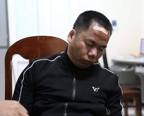 Trần Văn Luyện tại trụ sở công an.