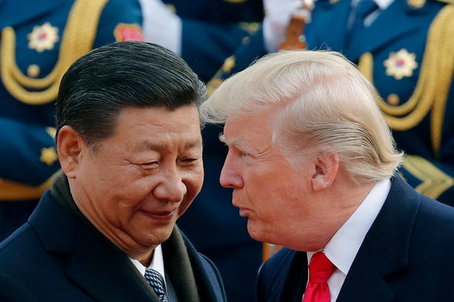 Chủ tịch Trung Quốc Tập Cận Bình (trái) và Tổng thống Mỹ Donald Trump. Ảnh: Andy Wong, AP