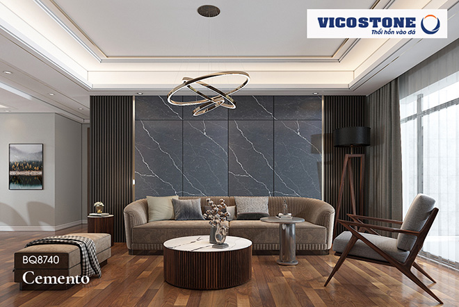 Mặt bàn đá VICOSTONE GRANDE nổi bật trong không gian tone trầm, được tạo nên bởi đá ốp tường CEMENTO màu xám tĩnh lặng cùng những đường vân rắn rỏi, mạnh mẽ.