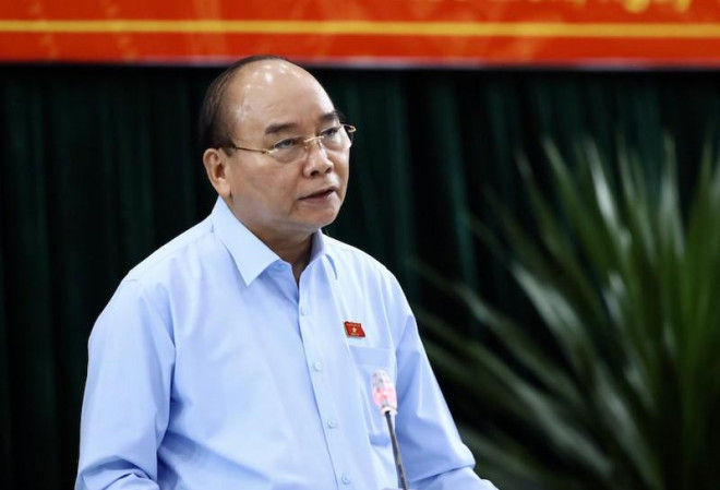 Chủ tịch nước Nguyễn Xuân Phúc trả lời cử tri. Ảnh: TÁ LÂM