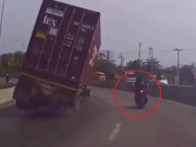 Thế giới xe - SỐC: Ôm cua cùng xe tải, xe tay ga suýt bị xe tải đổ đè bẹp