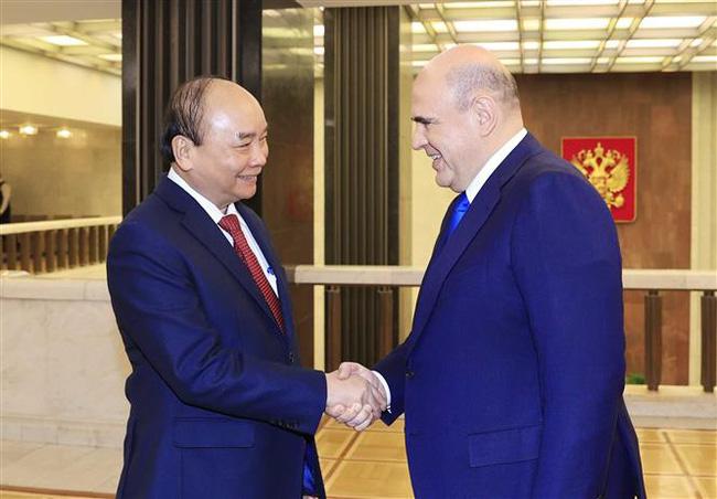 Chủ tịch nước Nguyễn Xuân Phúc và Thủ tướng Nga Mikhail Vladimirovich Mishustin. Ảnh: TTXVN