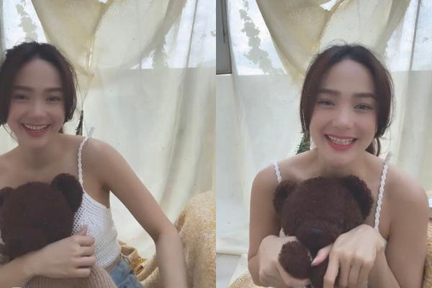 Minh Hằng cười ngượng ngùng và nhanh tay che chắn vòng 1