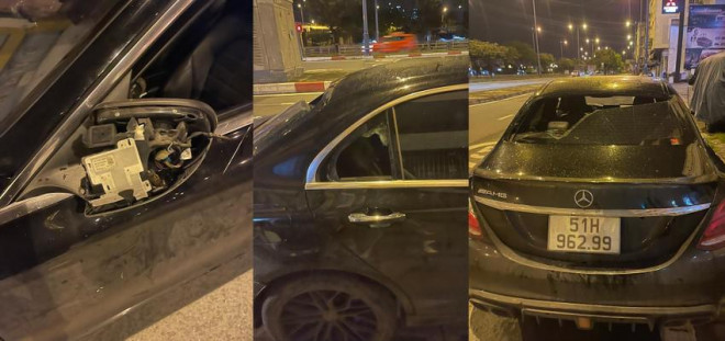 Chiếc xe Mercedes AMG bị đập phá hư hỏng kính, kính chiếu hậu. Ảnh: NDCC