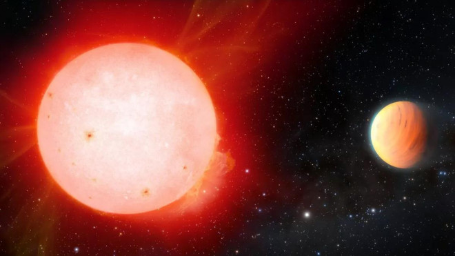 Ảnh đồ họa mô tả hành tinh kẹo dẻo (phảo) sáng lên với ánh màu hồng cam do được chiếu sáng bởi một ngôi sao lùn đỏ - Ảnh: NOIRLab/NSF/AURA