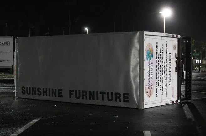 A box truck is knocked over by hurricane winds in a Florida parking lot. Photo: USA TODAY.