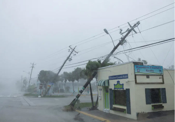 A power pole is knocked down by strong winds in Fort Myers, Florida, as Hurricane Milton makes landfall. Photo: Reuters