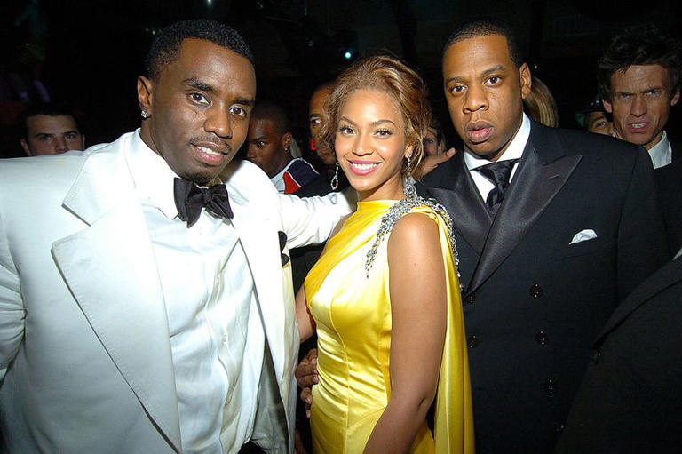 P Diddy poses at the event with Beyoncé and Jay-Z.