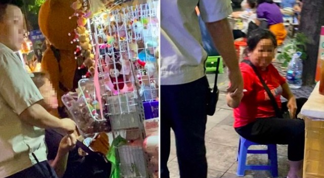 Nhân viên Đội An ninh trật tự thu tiền "làm luật" người bán hàng rong. Ảnh: TPO