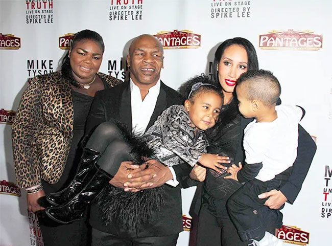 Mike Tyson and his wife with their two children and his stepdaughter in 2013. Before marrying his current wife, Mike Tyson went through two failed marriages and had five children with three women. Photo: Bei