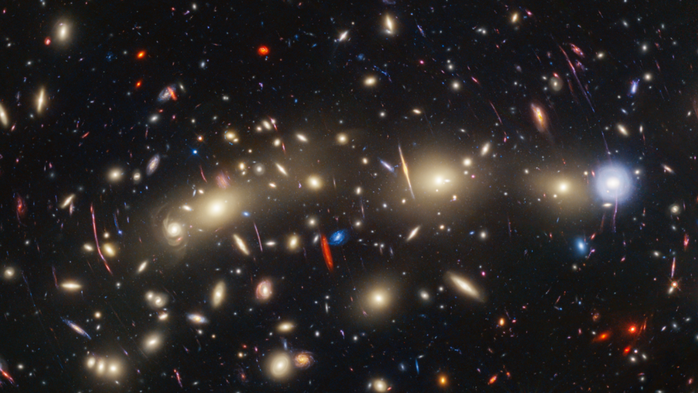 Một vùng vũ trụ được James Webb quan sát với sự trợ giúp của cụm thiên hà - thấu kính hấp dẫn MACS JO416 - Ảnh: NASA/ESA/CSA