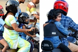 Trẻ em đi xe máy phải đội mũ bảo hiểm và đeo dây an toàn