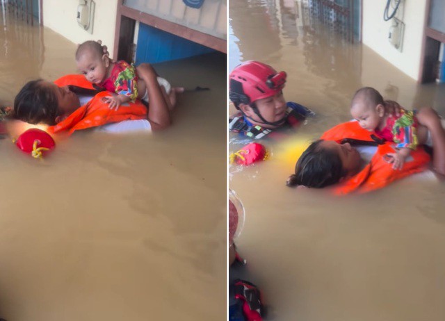 Đưa một em bé 5 tháng tuổi ra khỏi căn nhà đang bị ngập lụt lên đến tầng hai tại Hat Yai, tỉnh Songkhla. Ảnh: Facebook